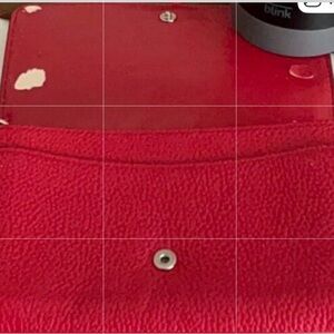 DAMAGED “COACH” PEBBLED RED LEATHER WALLET/WRISTLET.